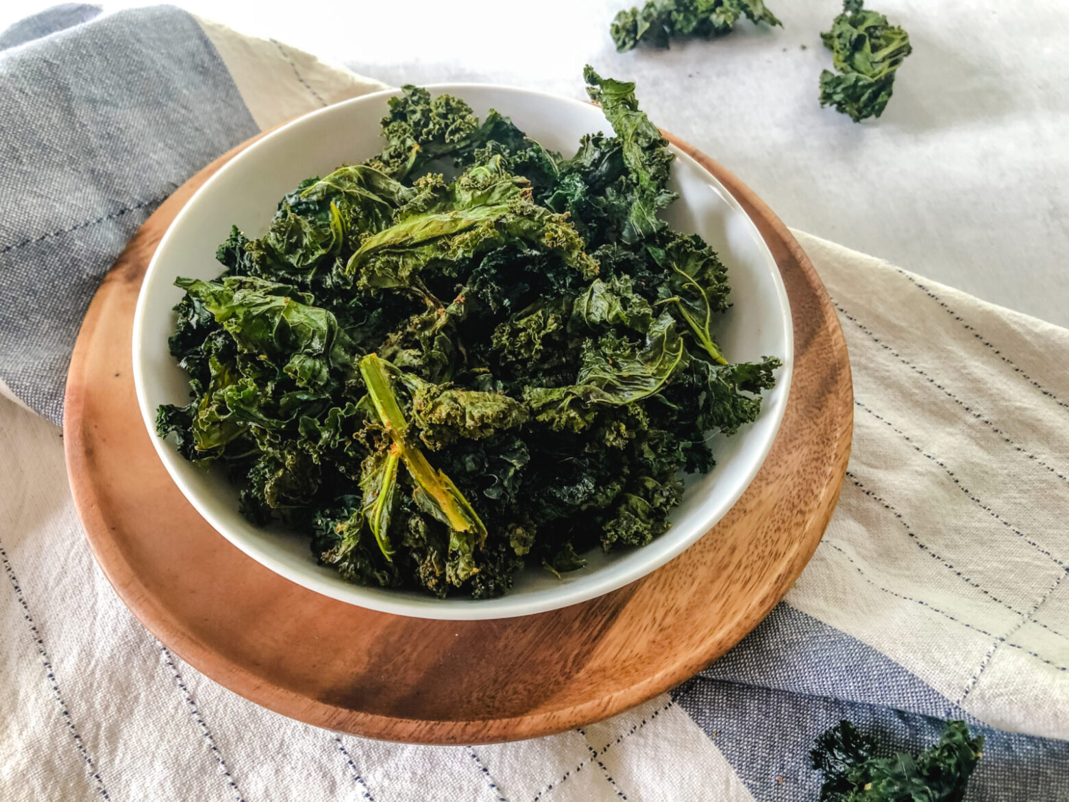 Easy Kale Chips recipe: Baked Kale Chips in a bowl on a table